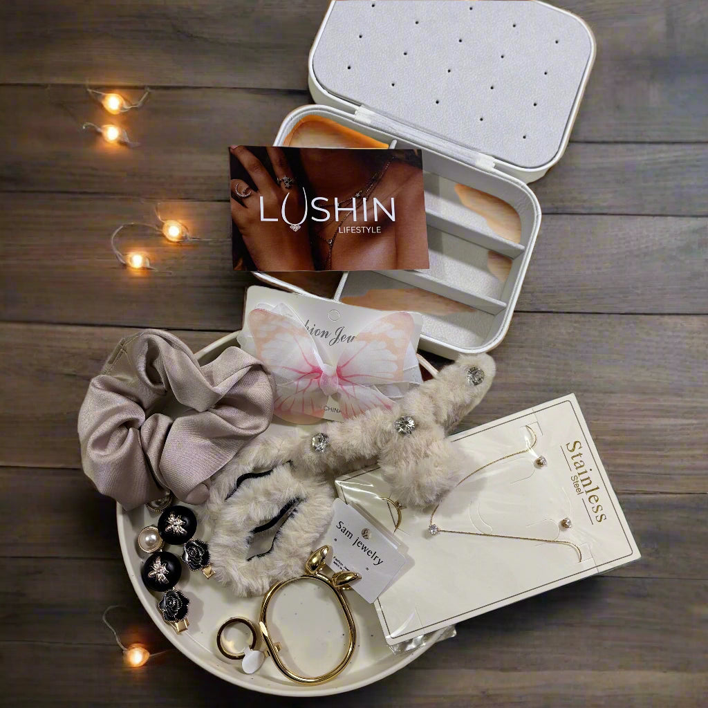 Jewelry set with earrings, hair scrunchie, and keychain on a light fabric background with LUSHIN branding.